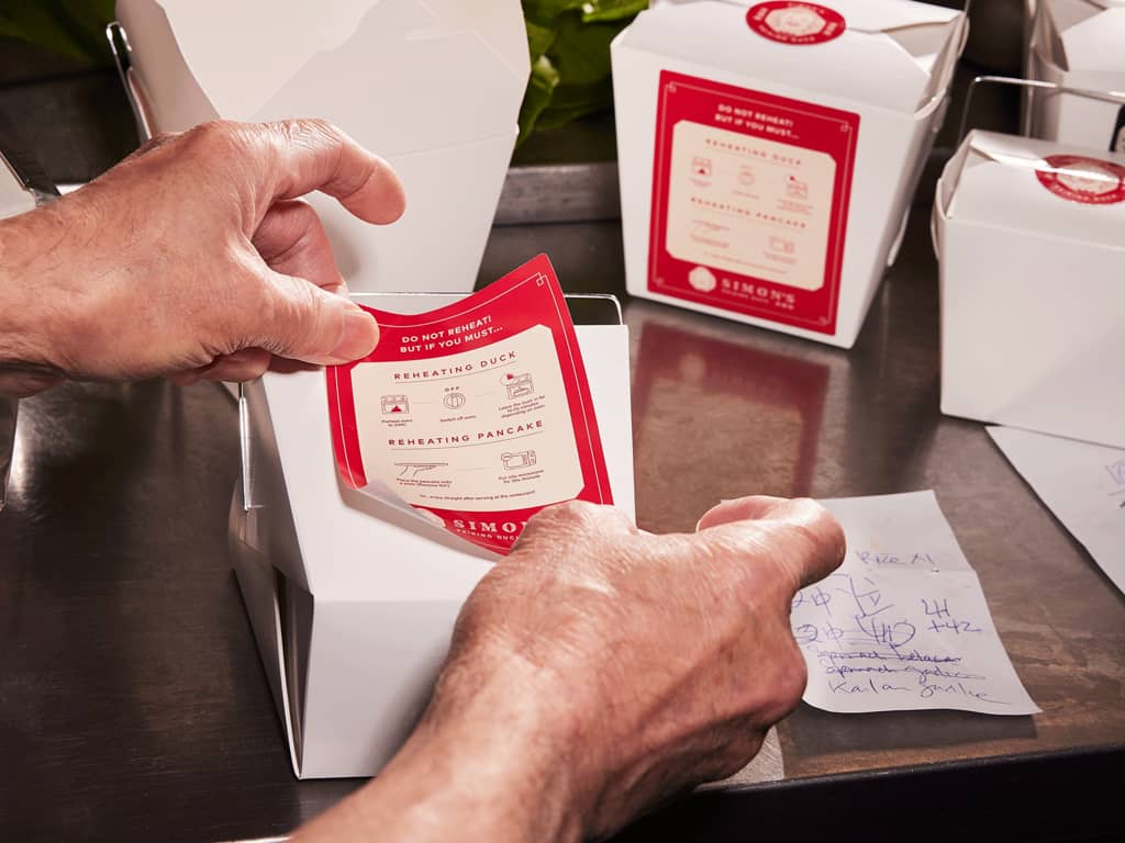 Hands sticking stationary down as part of their holiday packaging